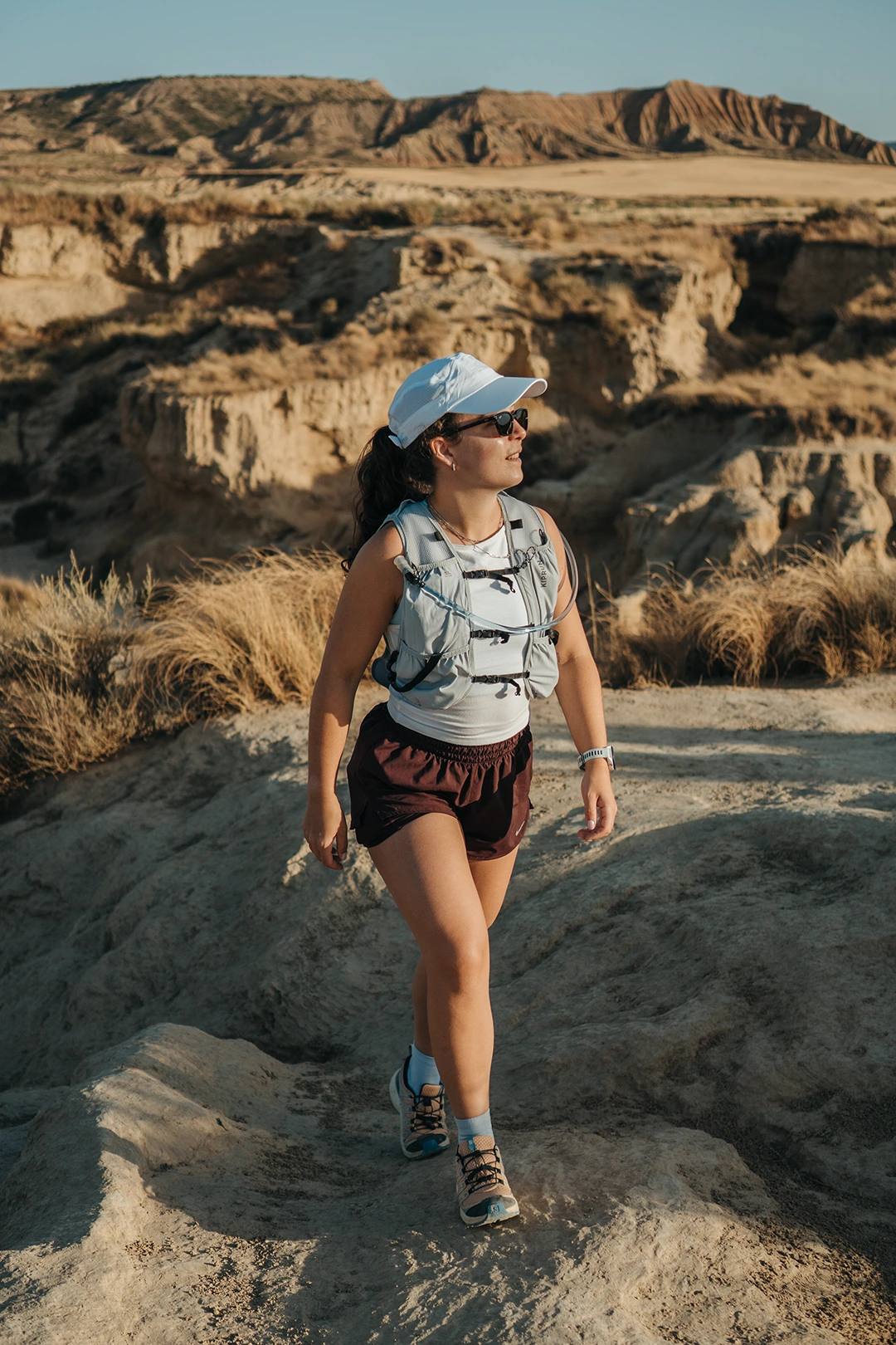 Britt walking through a rocky outdoor landscape